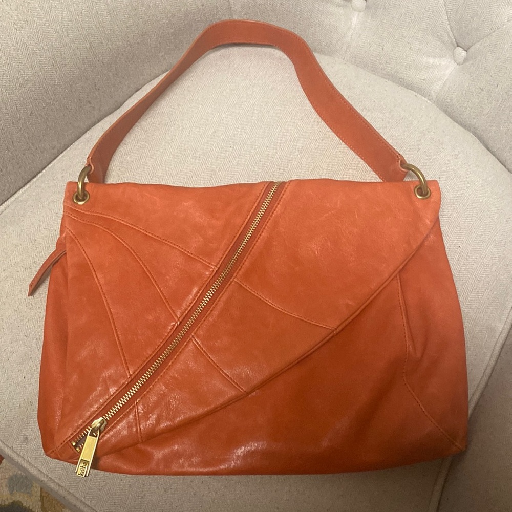 Extra super soft Kooba leather bag in lovely rusty orange to add a pop of color.